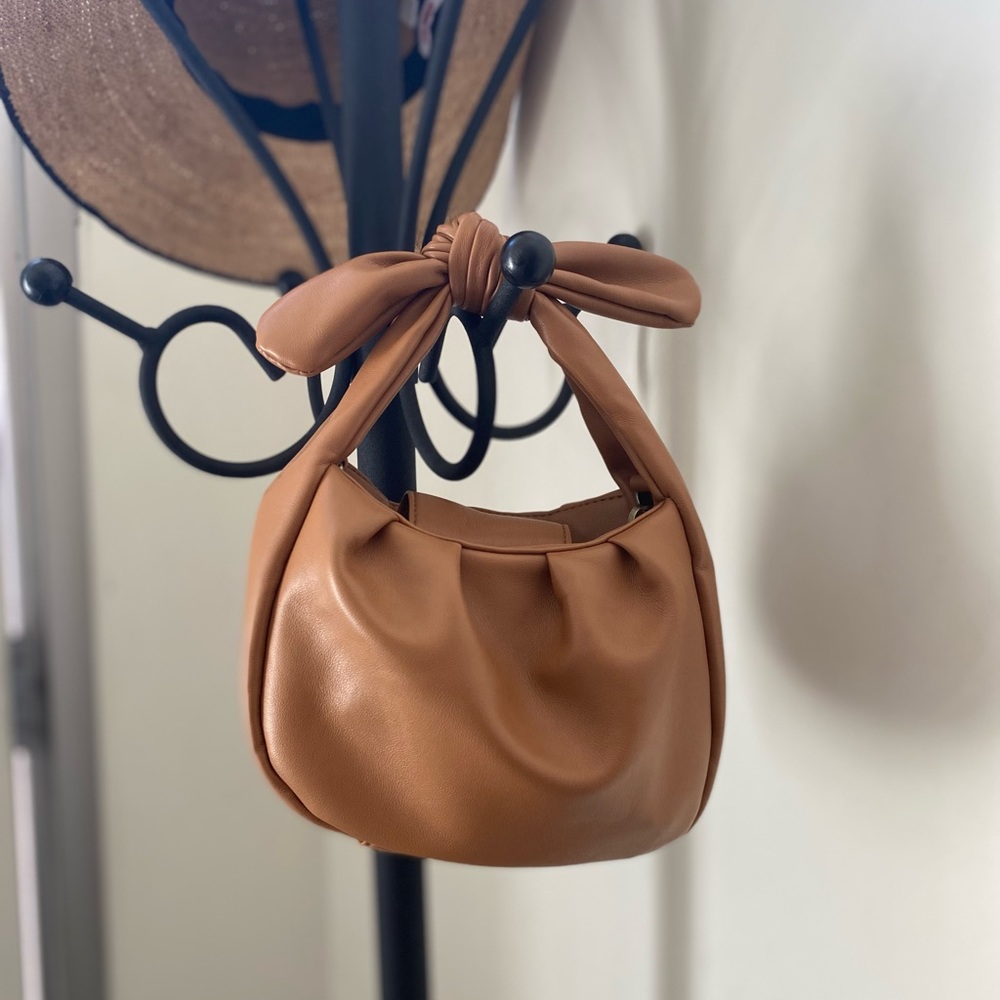 Anthropologie faux leather handbag w/ detachable hidden strap.